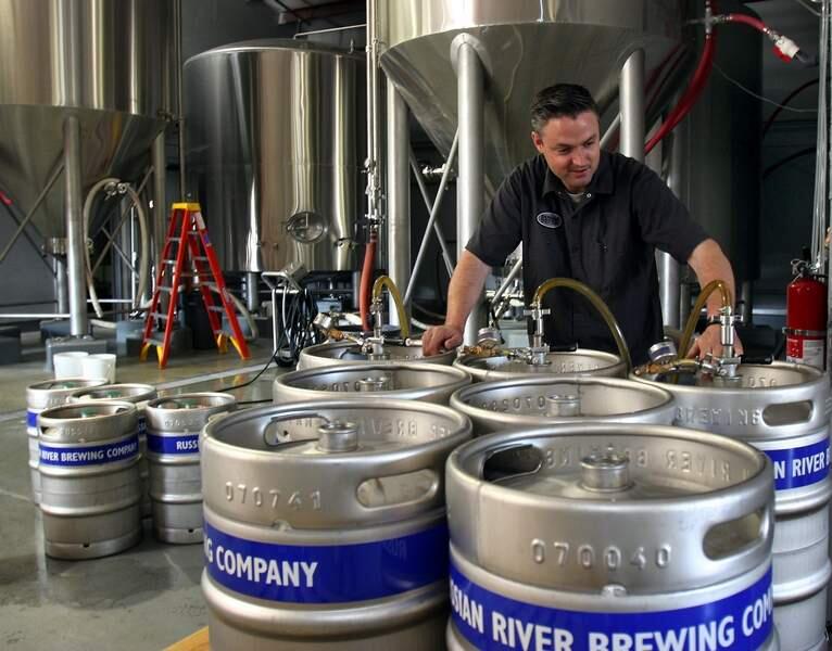 Vinnie Cilurzo fills up kegs at the Russian River Brewing Co. production facility in Santa Rosa in 2008. (PD FILE)