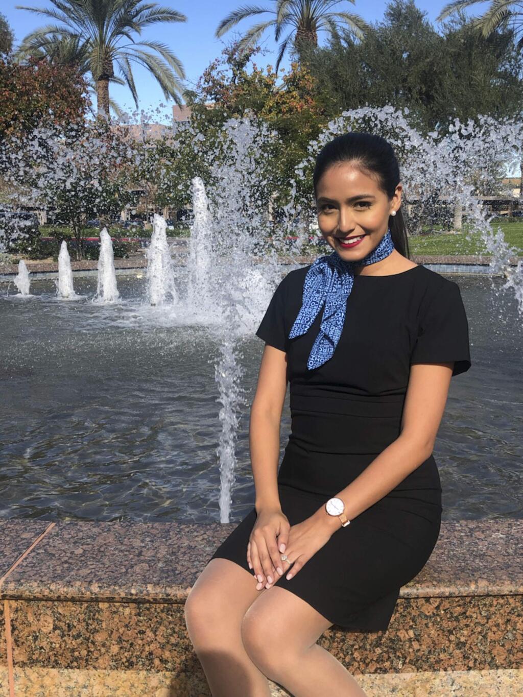 This 2018 photo provided by Feldman Strategies shows Selene Saavedra Roman. Selene Saavedra Roman, a flight attendant who traveled to Mexico for work with employment authorization through a program for immigrants brought to the country as children has been detained. Attorney Belinda Arroyo said Friday, March 22, 2019, that Mesa Airlines mistakenly assured 28-year-old Selene Saavedra Roman she could travel internationally but she was detained on her way back. Immigration and Customs Enforcement says she didn't have a valid document to enter the country. (Davo Watsui/Feldman Strategies via AP)