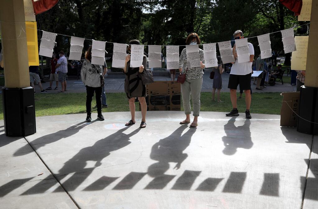Notes as part of an installation of a demonstration against racism are displayed at the Healdsburg Plaza on June 11. (Kent Porter/The Press Democrat)