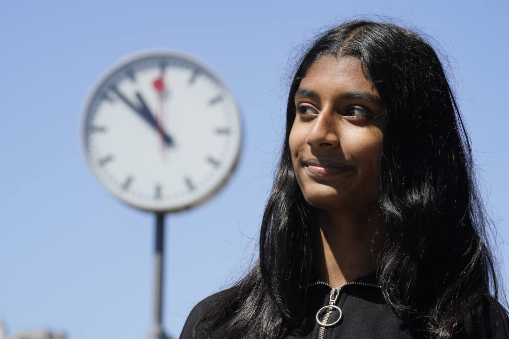 Hansika Daggolu, an incoming junior at Mission San Jose High School, poses in San Francisco, Tuesday, June 28, 2022. Middle and high school students in California will be able to sleep a little bit later when the new school year starts. Hansika, 15, said she is happy she will no longer have to rise before 7 a.m. herself to get to school by 8 a.m. The overall mood, she suspects, will lift as well. (AP Photo/Eric Risberg)