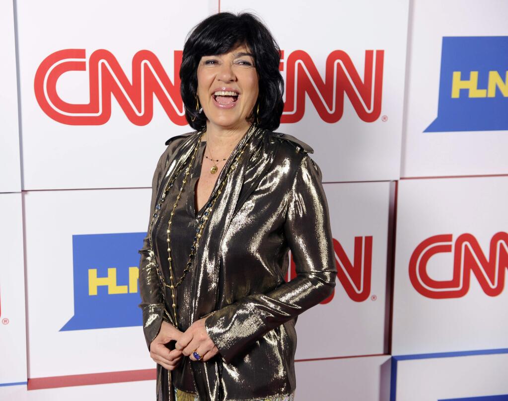 FILE - In this Jan. 10, 2014, file photo, Christiane Amanpour of CNN reacts to photographers at the CNN Worldwide All-Star Party in Pasadena, Calif. Amanpour is helping PBS fill the gap created by Charlie Rose's exit. On an interim basis, public TV stations will be able to air Amanpour's weekday public affairs program that originates on CNN International. (Photo by Chris Pizzello/Invision/AP, File)