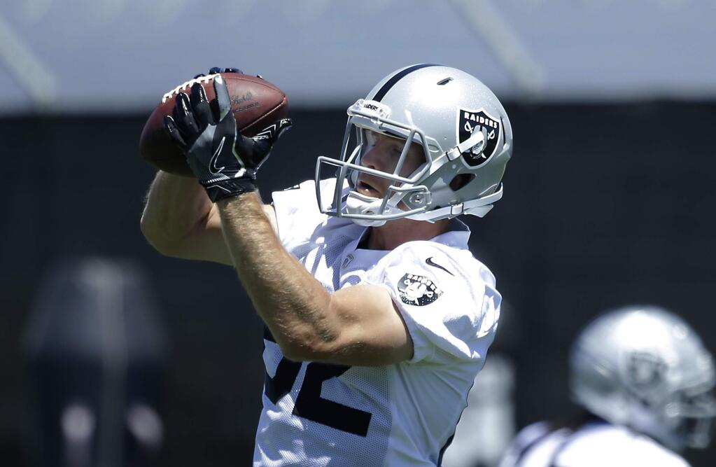 Oakland Raiders wide receiver Jordy Nelson grabs a pass at the NFL football team's minicamp Wednesday, June 13, 2018, in Alameda, Calif. (AP Photo/Rich Pedroncelli)