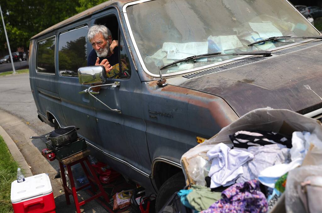 Albert Bruin, 75, looks out from his van, where he lives, along Challenger Way, in Santa Rosa on Tuesday, August 7, 2018. (Christopher Chung/ The Press Democrat)