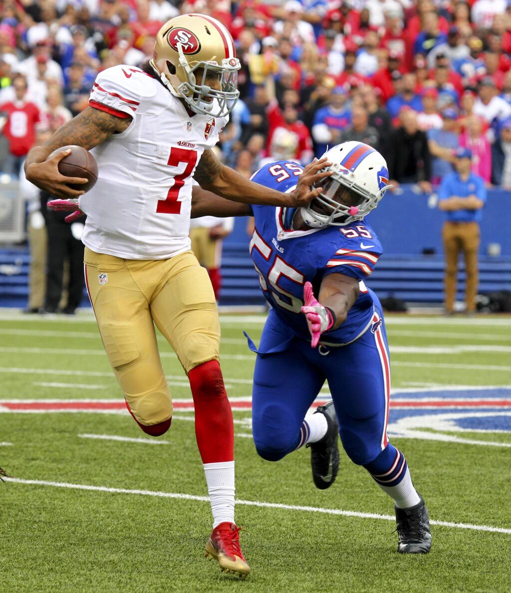 San Francisco 49ers quarterback Colin Kaepernick (7) pushes off Buffalo Bills outside linebacker Jerry Hughes (55) during the second half of an NFL football game on Sunday, Oct. 16, 2016, in Orchard Park, N.Y. (AP Photo/Jeffrey T. Barnes)