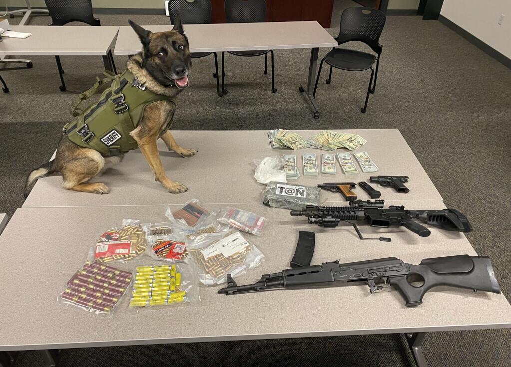 Sonoma County Sheriff’s Office officials arrested two men after finding a total of about 4 pounds of cocaine, $34,000 in cash, four firearms and packaging for drug sales in their possession during two searches last week. (Sonoma County Sheriff’s Office)