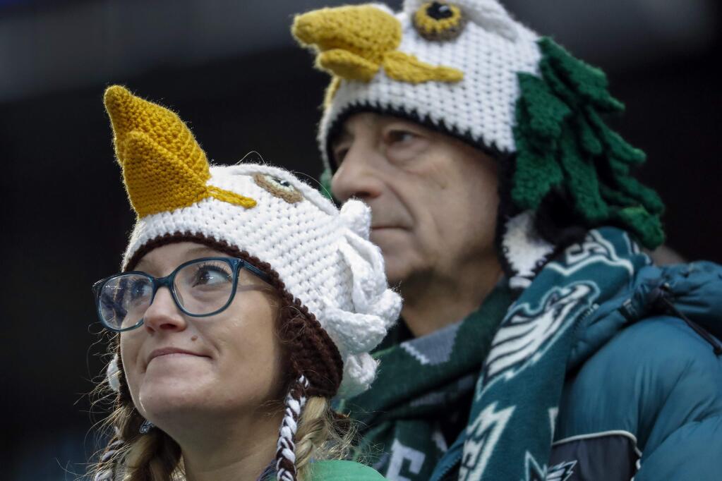 Philadelphia Eagles fans wait before the NFL Super Bowl 52 football game between the Eagles and the New England Patriots Sunday, Feb. 4, 2018, in Minneapolis. (AP Photo/Charlie Neibergall)