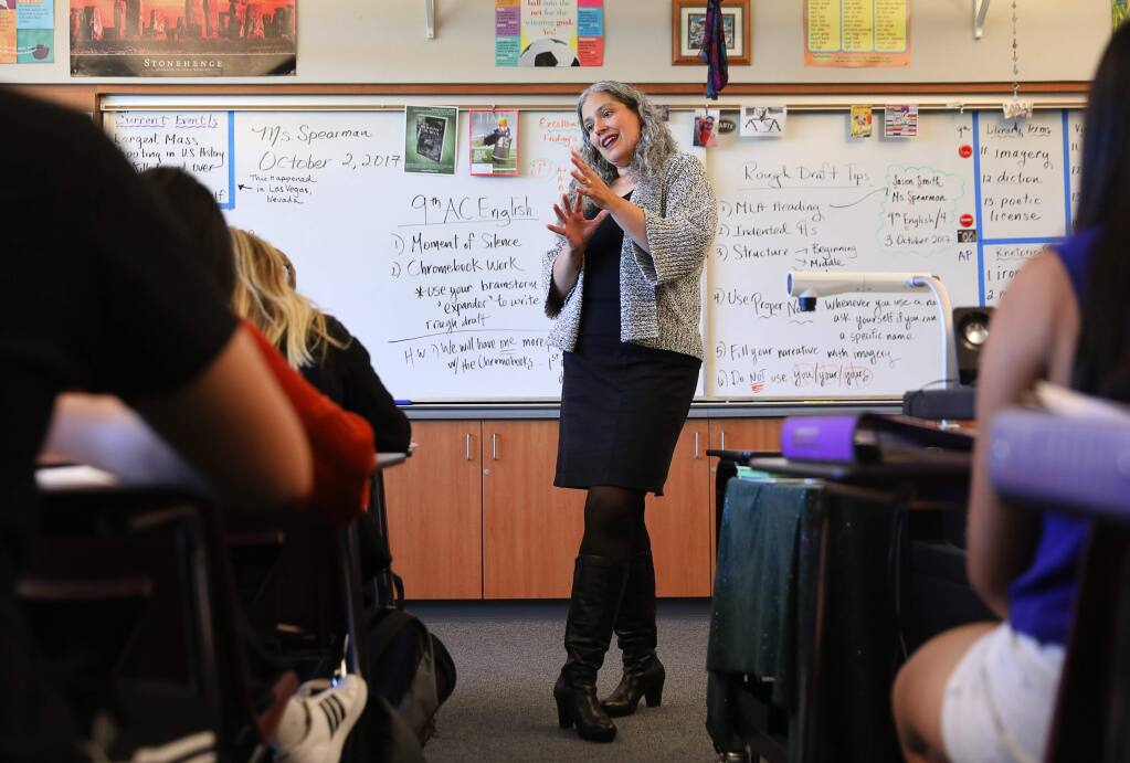 Simone Spearman discusses an essay writing assignment with her AP Language and Composition class at Piner High School, in Santa Rosa Monday, Oct. 2, 2017. Spearman has recently published her book 'The Dragons of Durga.' (Christopher Chung/ The Press Democrat)