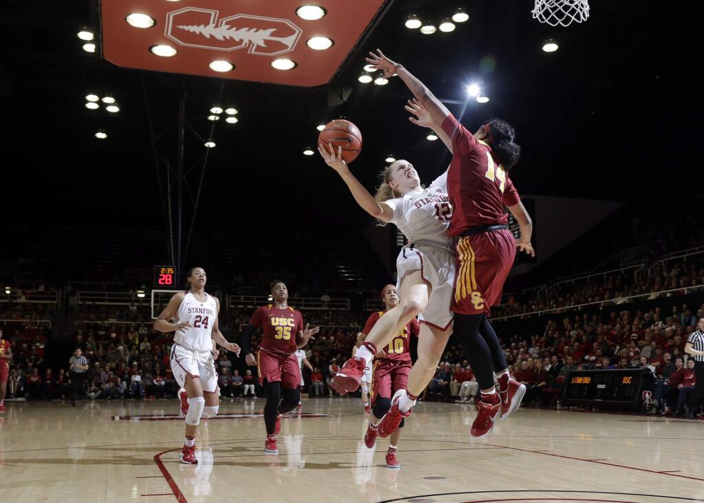 Stanford guard Brittany McPhee (12) drives to the basket as USC guard Sadie Edwards (14) defends during the second half Friday, Feb. 3, 2017, in Stanford. (AP Photo/Marcio Jose Sanchez)