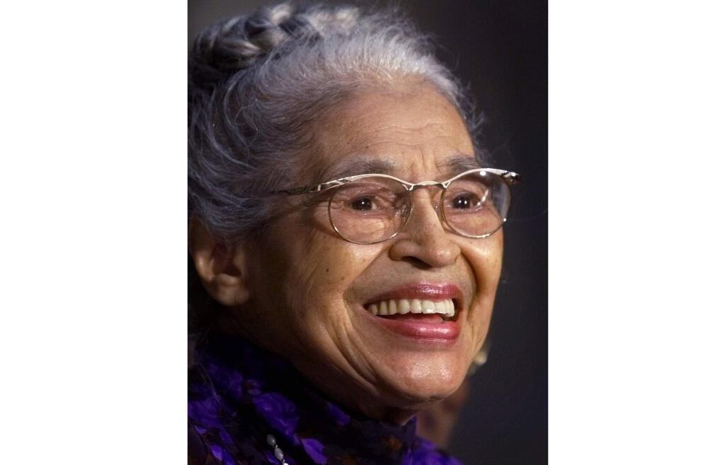 FILE -- In a June 15, 1999 file photo Rosa Parks smiles during a Capitol Hill ceremony where Parks was honored with the Congressional Gold Medal in Washington. A new statue of civil rights pioneer Rosa Parks will be unveiled in downtown Montgomery, Ala., on Sunday, Dec. 1, 2019. (AP Photo/Khue Bui, File)