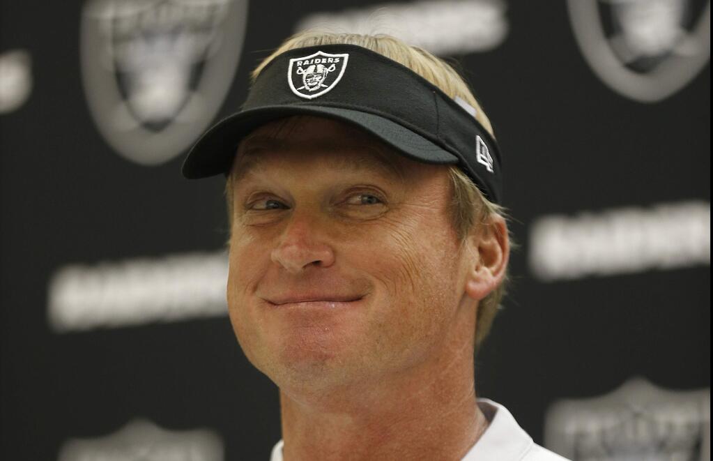Oakland Raiders head coach Jon Gruden speaks at a news conference after a preseason game between the Raiders and the Detroit Lions in Oakland, Friday, Aug. 10, 2018. (AP Photo/D. Ross Cameron)
