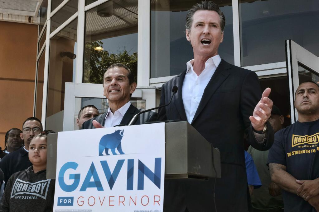 Gavin Newsom, the Democratic nominee for governor, speaks at a June 19 news conference in Los Angeles. (RICHARD VOGEL / Associated Press)