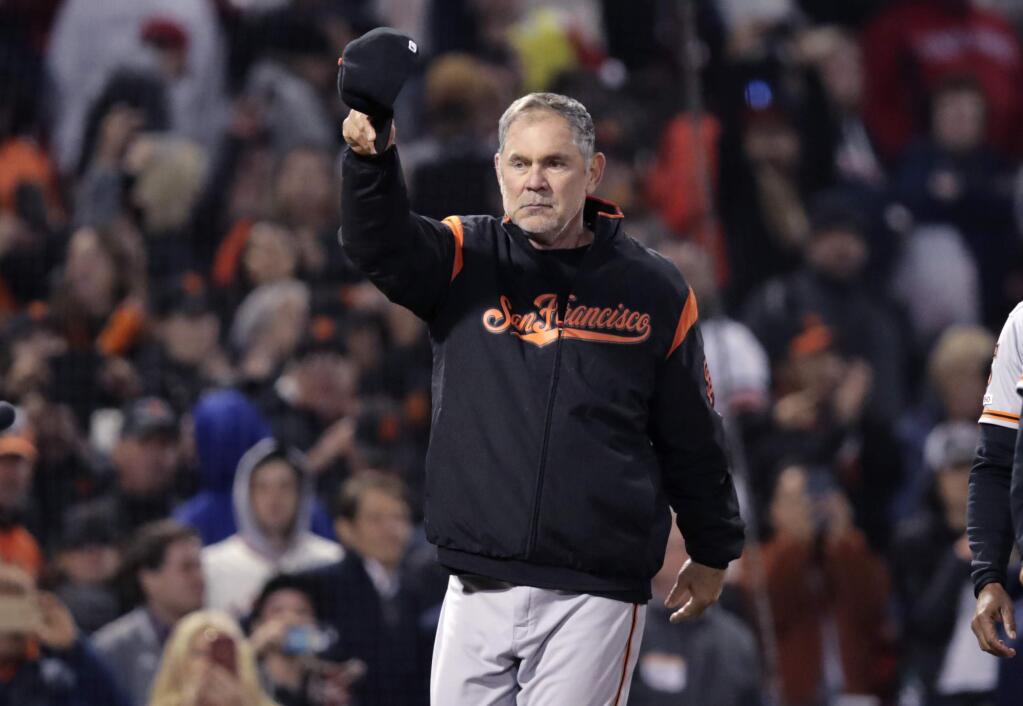 San Francisco Giants manager Bruce Bochy tips his cap after the Giants defeated the Boston Red Sox 11-3 for his 2,000th career win, at Fenway Park in Boston, Wednesday, Sept. 18, 2019. (AP Photo/Charles Krupa)