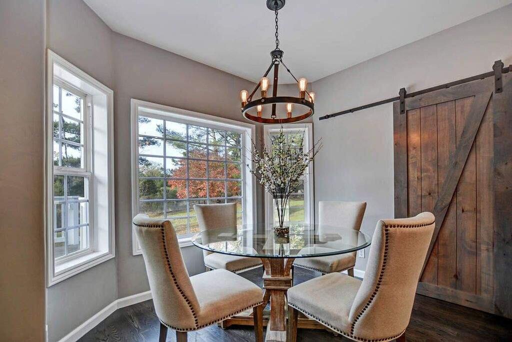 A dining room with a bay window and sliding barn doors. Property listed by Paula Parks/ Sotheby's International Realty, sothebyshomes.com, 707-935-2286. (Courtesy of BAREIS)