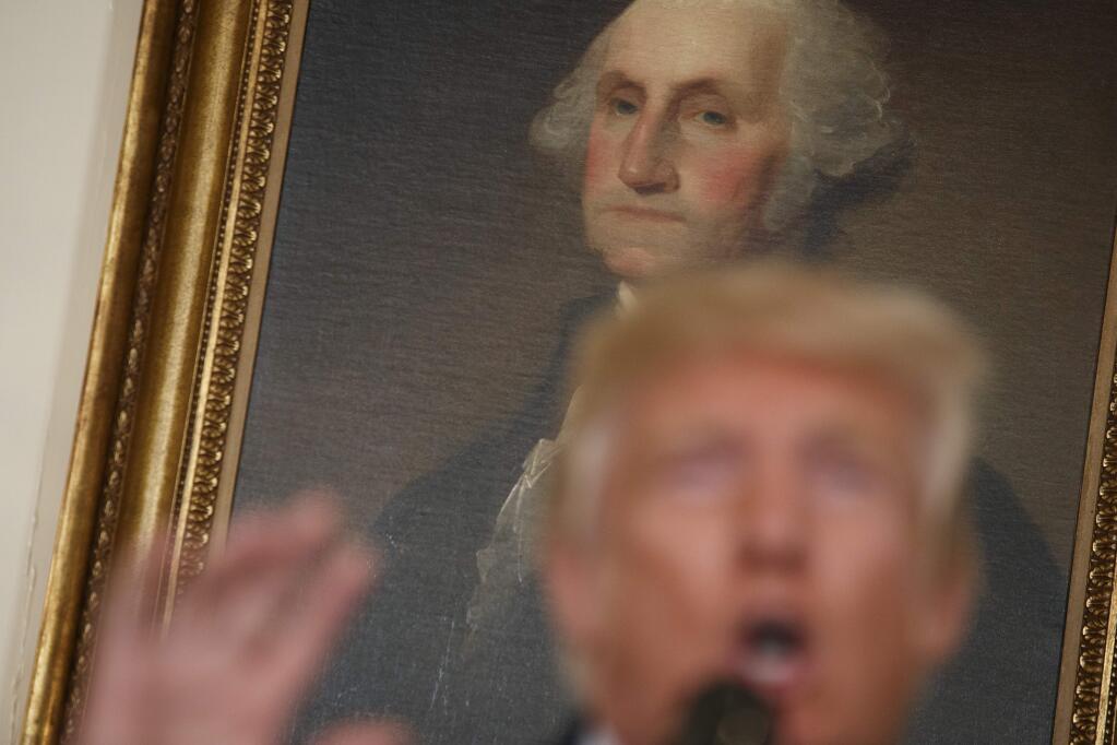 A portrait of George Washington hangs behind President Donald Trump as he speaks about the deadly white nationalist rally in Charlottesville, Va., Monday, Aug. 14, 2017, in the Diplomatic Room of the White House in Washington. (AP Photo/Evan Vucci)