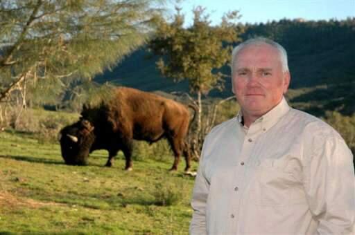 (File photo) Lake County Supervisor Rob Brown, pictured with a bison on his 300-acre ranch.