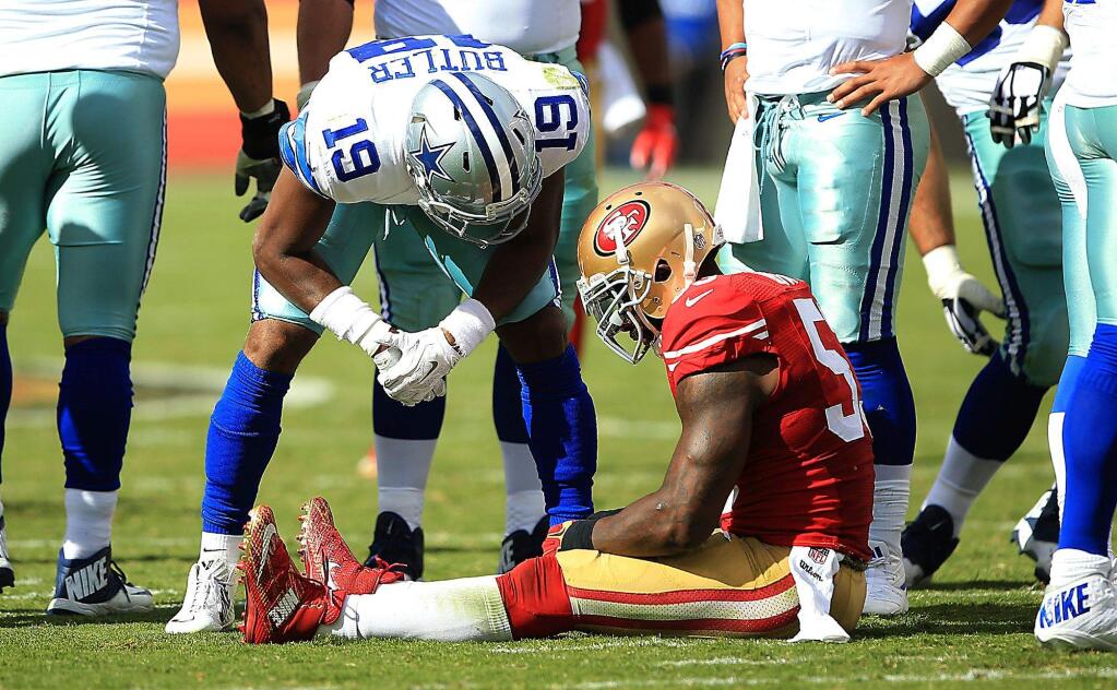 NaVorro Bowman sits injured on the field against Dallas during the 49ers 24-17 loss to the Cowboys, Sunday Oct. 2, 2016 at Levi's Stadium. Bowman had a torn Achilles tendon, and injury that ended his season. Kent Porter / The Press Democrat) 2016