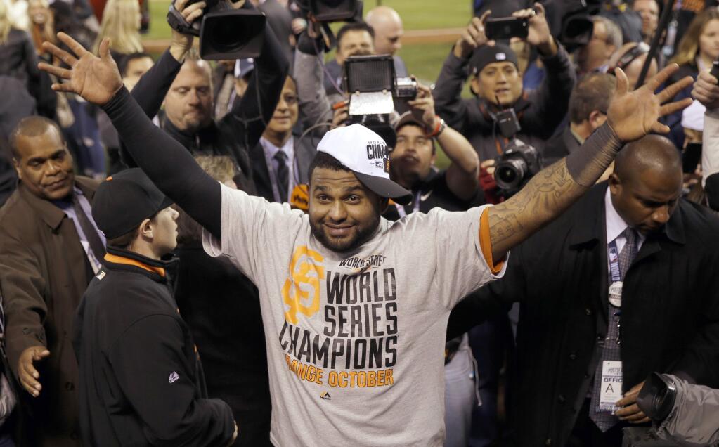 FILE - In this Oct. 29, 2014, file photo, San Francisco Giants' Pablo Sandoval celebrates after Game 7 of baseball's World Series against the Kansas City Royals in Kansas City, Mo. The Giants won 3-2 to win the series. Giants assistant general manager Bobby Evans says he has been given 'every indication' the free agent third baseman will give careful consideration to re-signing with the World Series champions. (AP Photo/Matt Slocum)