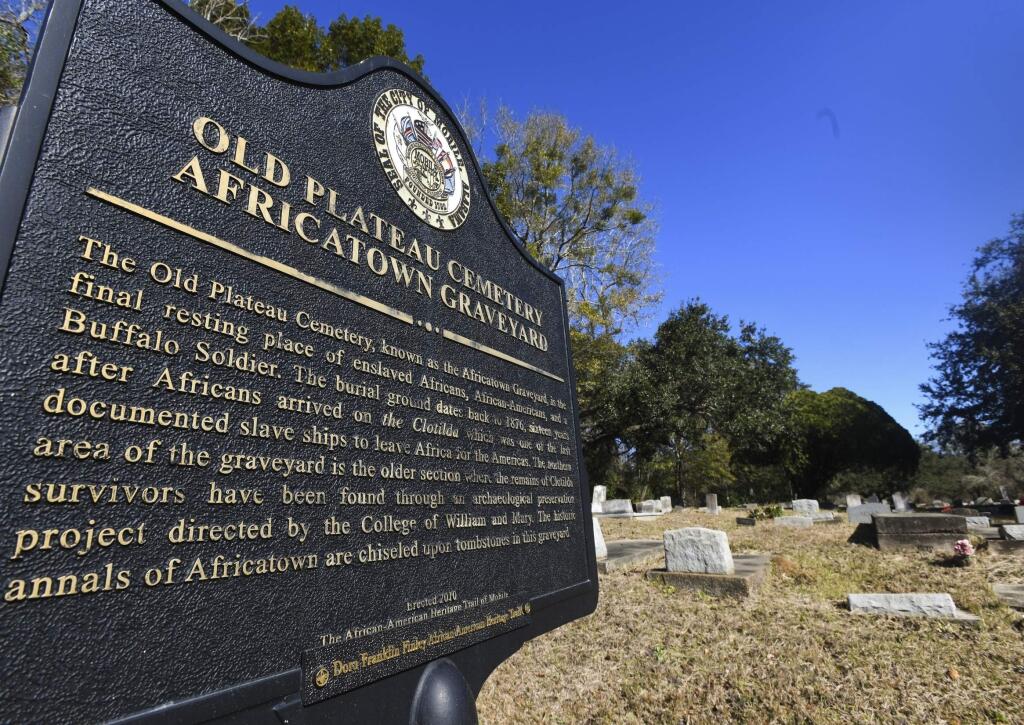 Old Plateau Cemetery, the final resting place for many who spent their lives in Africatown, stands in need of upkeep near Mobile, Ala., on Tuesday, Jan. 29, 2019. Many of the survivors of the Clotilda's voyage are buried here amongst the trees. (AP Photo/Julie Bennett)