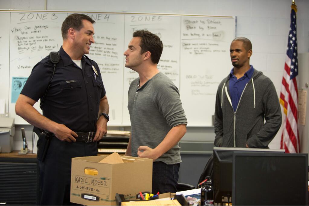 This image released by 20th Century Fox shows Rob Riggle, from left, Jake Johnson, and Damon Wayans, Jr. in a scene from, 'Let's Be Cops.' (AP Photo/20th Century Fox, Frank Masi)