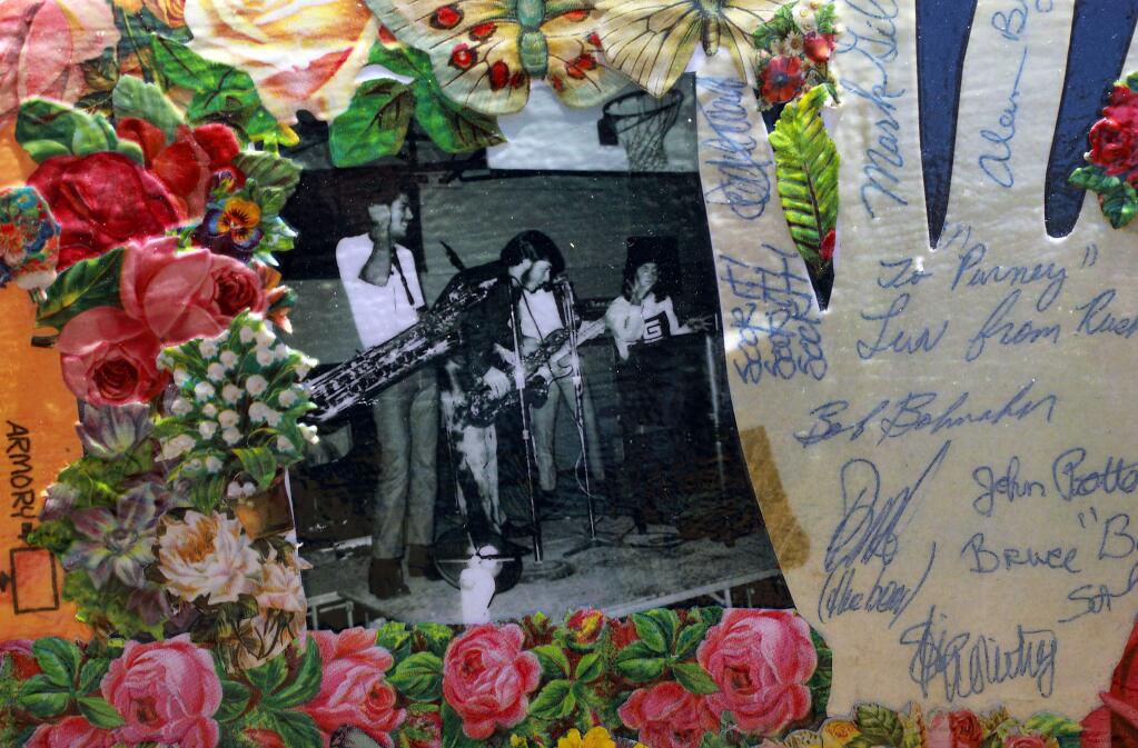 Donna Huggins of San Rafael spent months cutting out and placing die cuts, old posters and replicas of the autographs she collected following bands in the 1960's on her 1967 Summer of Love Rolls Royce. (John Burgess/The Press Democrat)