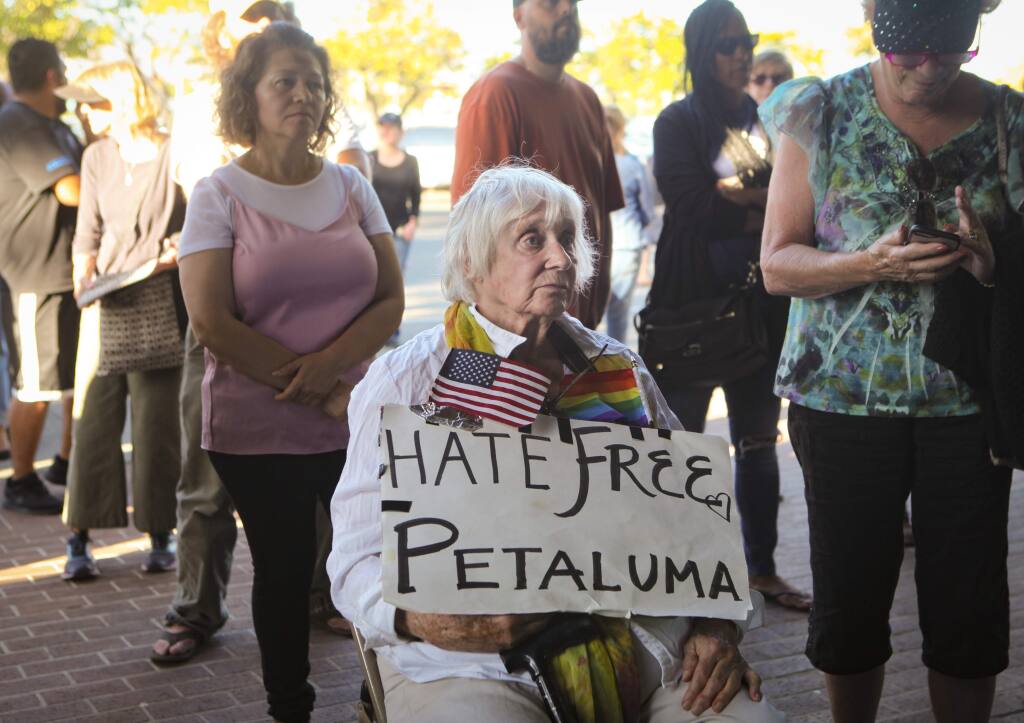 Petaluma, CA, USA._Friday, July 12, 2019._Carol Horn listens to speakers during the 'Lights for Liberty: Vigil to End Concentration Camps' at the Petaluma Public Library on Friday.(CRISSY PASCUAL/ARGUS-COURIER STAFF)