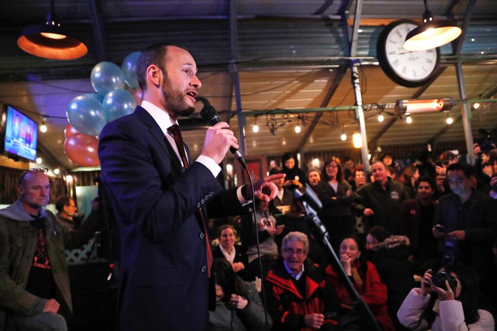 In this Tuesday, Nov. 5, 2019, photo, San Francisco District Attorney candidate Chesa Boudin speaks during an election night event at SOMA StrEat Food Park in San Francisco. Boudin, the son of anti-war radicals sent to prison for murder when he was a toddler, has won San Francisco's tightly contested race for district attorney after campaigning to reform the criminal justice system. (Scott Strazzante/San Francisco Chronicle via AP)
