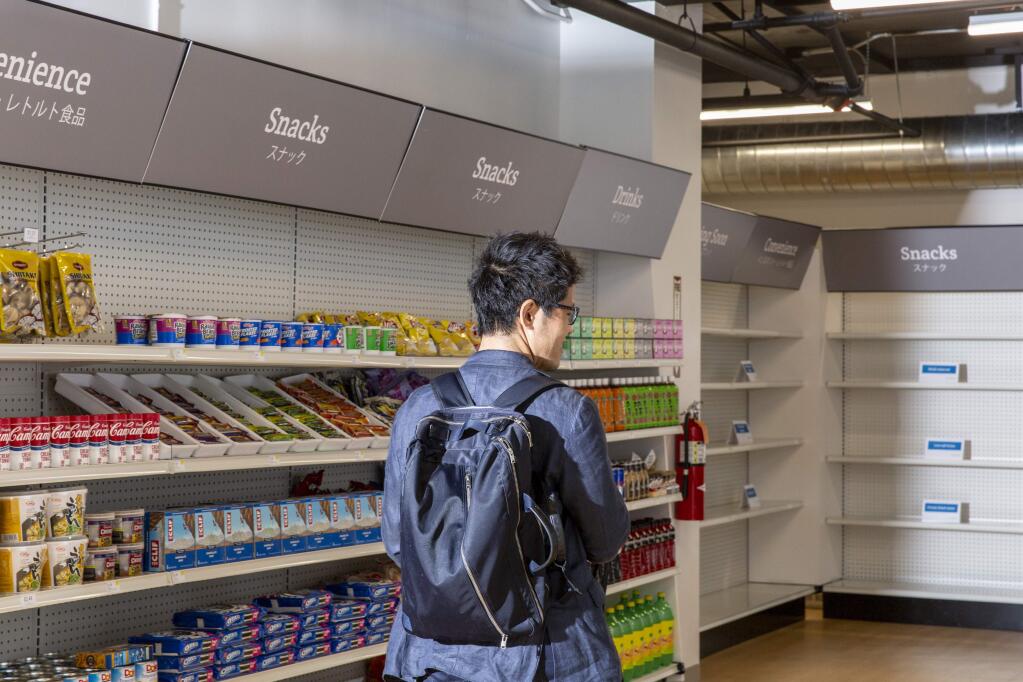 Yoshimasa Takahashi visits Standard Market, San Francisco's first cashierless and checkoutless grocery store, Sept. 7, 2018. Shoppers who have downloaded the store's app can grab items and simply leave.; cameras identify the shopper and the items, and determine when said items leave with said shopper. At least, that's the idea. (Cayce Clifford/The New York Times)