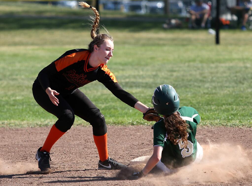Maria Carrillo's Bethany Devault slides safely into second as Santa Rosa's Briana Ririe is late on the tag during the game held at Maria Carrillo High School, Thursday, April 2, 2015. (Crista Jeremiason / The Press Democrat)