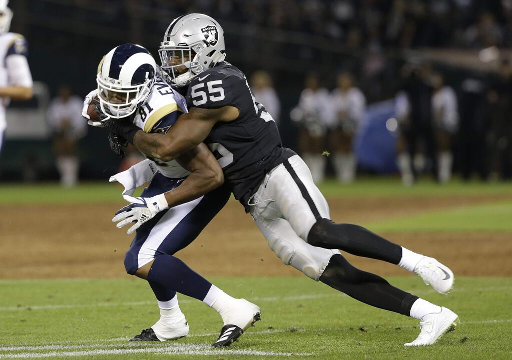 In this Saturday, Aug. 19, 2017 file photo, Oakland Raiders linebacker Marquel Lee tackles Los Angeles Rams tight end Gerald Everett during the first half of a preseason game in Oakland. (AP Photo/Rich Pedroncelli, File)