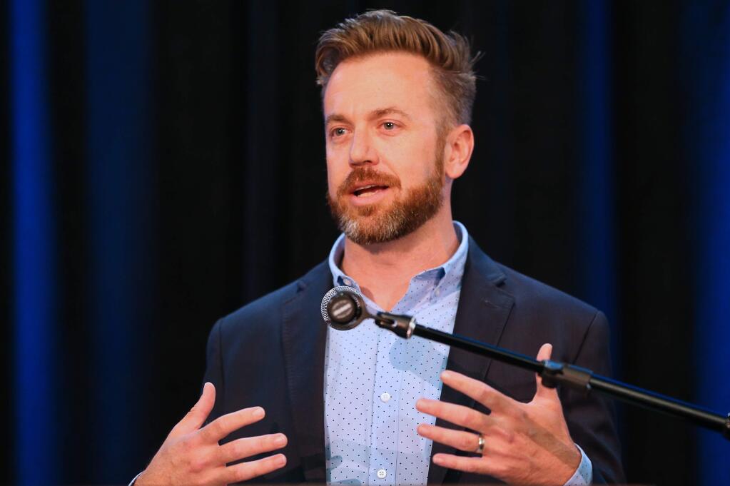 Chris Denny speaks after receiving the 2019 Next Gen Community Impact Award during the James B. and Billie Keegan Leadership Series lunch in Rohnert Park on Thursday, May 2, 2019. (Christopher Chung/ The Press Democrat)