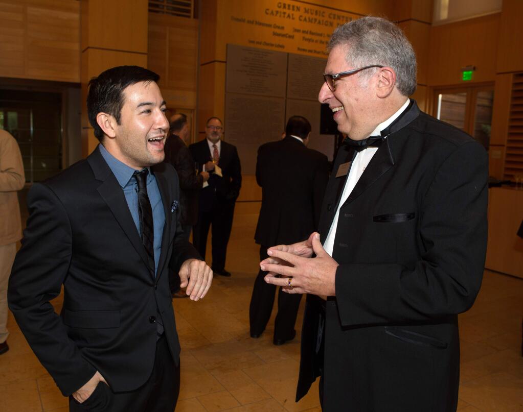 Francesco Lecce-Chong, a music director candidate, left, talks to Alan Silow, President and CEO of Santa Rosa Symphony, during the 'Celebrating Donald Green A Sonoma County Cultural Icon' reception, an opening celebration of the Santa Rosa Symphony season at the Donald & Maureen Green Music Center in Rohnert Park on Friday, October 6, 2017. (Photo by Darryl Bush / For The Press Democrat)