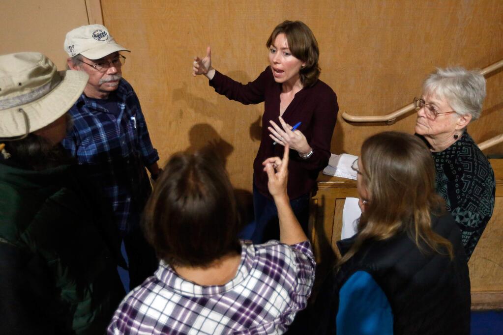 Sonoma County Fifth District supervisor Lynda Hopkins, center, talks with Guerneville residents after a town hall meeting at Guerneville School, in Guerneville, California on Wednesday, March 29, 2017. (Alvin Jornada / The Press Democrat)