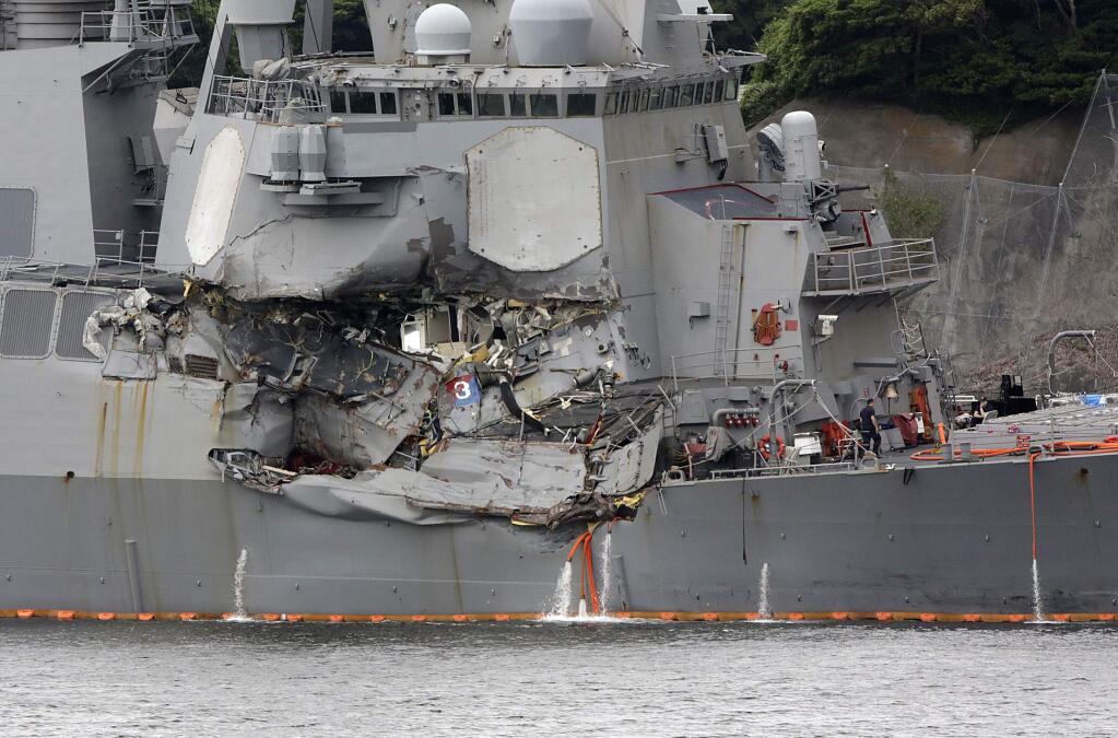 The damaged part of USS Fitzgerald is seen at the U.S. Naval base in Yokosuka. (EUGENE HOSHIKO / Associated Press)