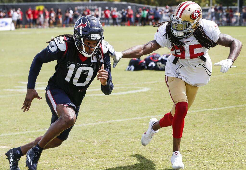 In this Aug. 16, 2018, file photo, Houston Texans wide receiver DeAndre Hopkins (10) and San Francisco 49ers defensive back Richard Sherman (25) run extra drills after a joint practice in Houston. (Brett Coomer/Houston Chronicle via AP, File)