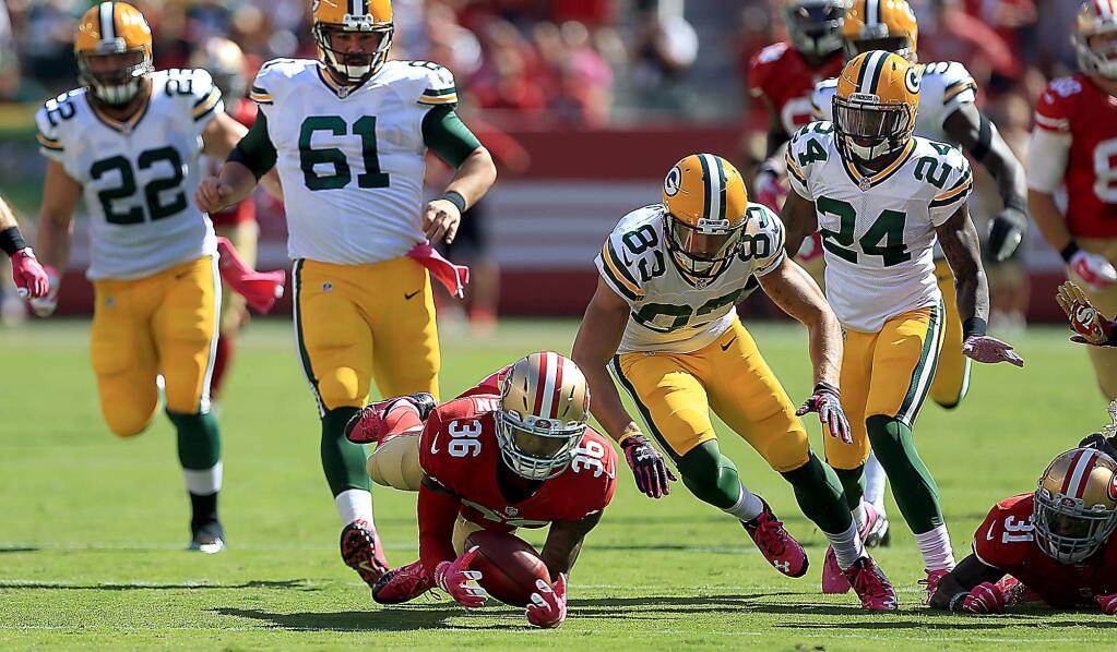 Dontae Johnson recovers a fumble after teammate Jarryd Hayne fumbled a fair catch on a punt during the Packers 17-3 win at Levi Stadium, in Santa Clara, Sunday Oct. 4, 2015. (Kent Porter / Press Democrat) 2015