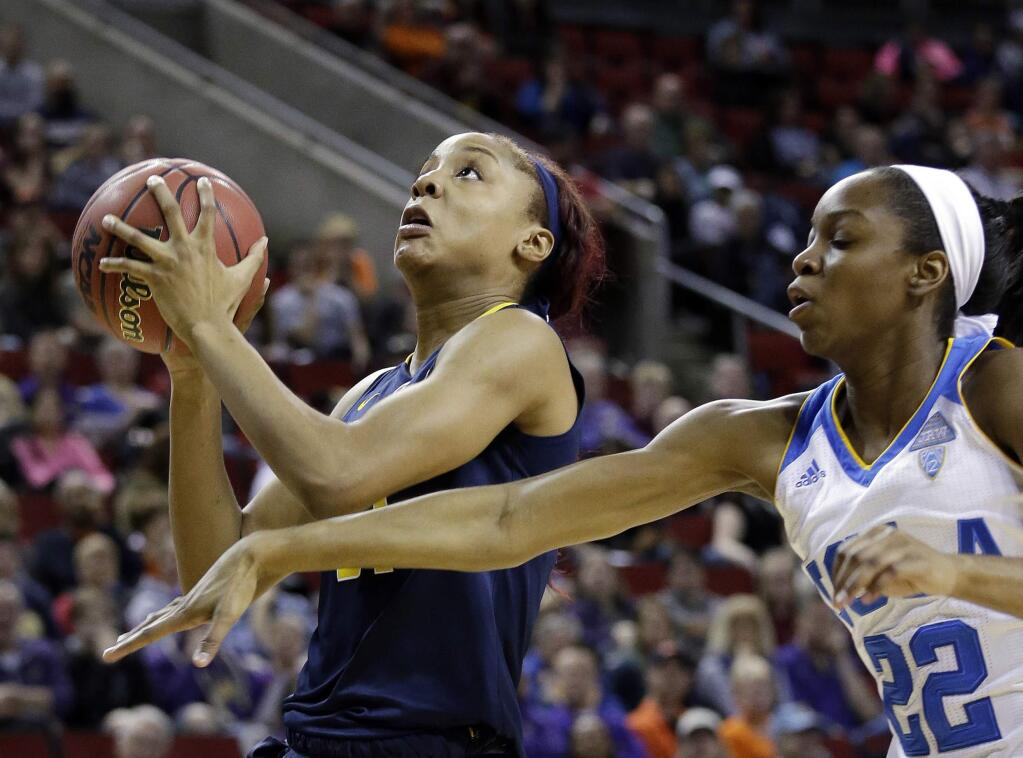 FILE - In this March 5, 2016, file photo, California's Kristine Anigwe, left, shoots as UCLA's Kennedy Burke defends during the first half of an NCAA college basketball game in the Pac-12 Conference women's tournament in Seattle. A few days after Golden State Warriors star Klay Thompson went off for 60 points in less than three quarters, reigning Pac-12 women's basketball Freshman of the Year Anigwe notched a milestone night of her own in the East Bay. (AP Photo/Elaine Thompson, File)