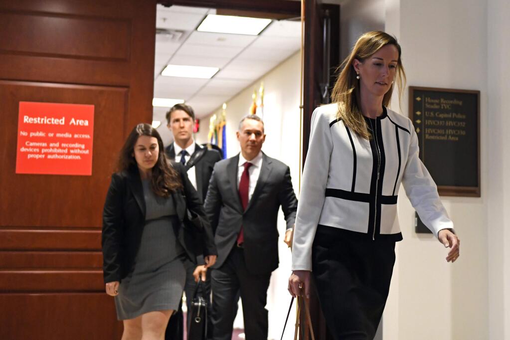 Jennifer Williams, a special adviser to Vice President Mike Pence for Europe and Russia who is a career foreign service officer, departs after a closed-door interview in the impeachment inquiry on President Donald Trump's efforts to press Ukraine to investigate his political rival, Joe Biden, at the Capitol in Washington, Thursday, Nov. 7, 2019. (AP Photo/Susan Walsh)