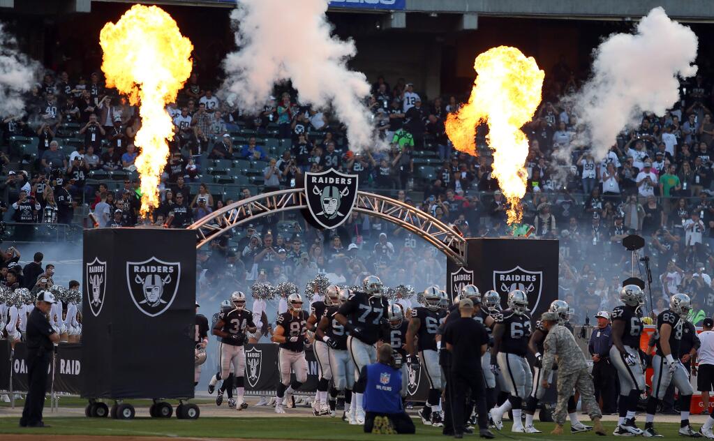 The Oakland Raiders take the field against the Seattle Seahawks during their preseason game in Oakland on Thursday, Aug. 28, 2014. (CHRISTOPHER CHUNG/ PD FILE)