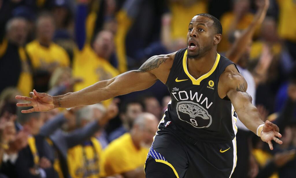 The Golden State Warriors' Andre Iguodala celebrates a score against the San Antonio Spurs in the second half in Game 2 of their first-round series, Monday, April 16, 2018, in Oakland. Golden State won 116-101. (AP Photo/Ben Margot)