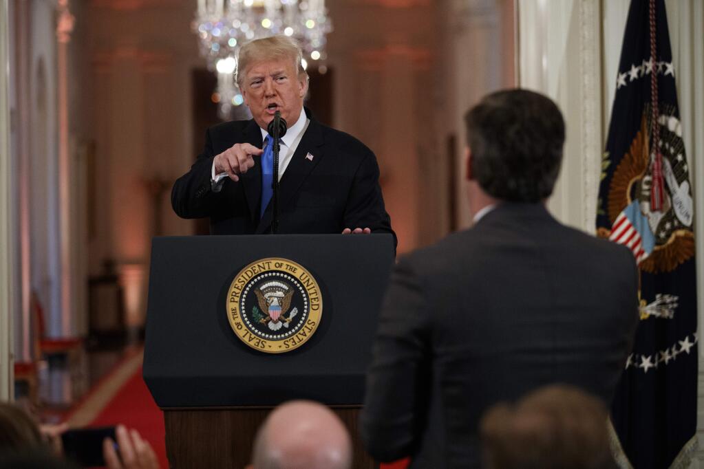 President Donald Trump speaks to CNN reporter Jim Acosta during a news conference on Nov. 7. (EVAN VUCCI / Associated Press)
