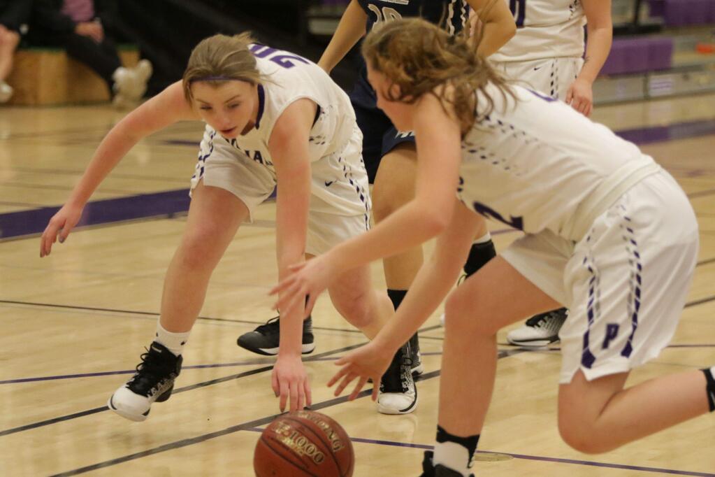 DWIGHT SUGIOKA/FOR THE ARGUS--COURIERPetaluma's Angelina Scaccalosi and Madeline Abramason scramble for a loose ball during their team's 53-32 win over Elsie Allen.