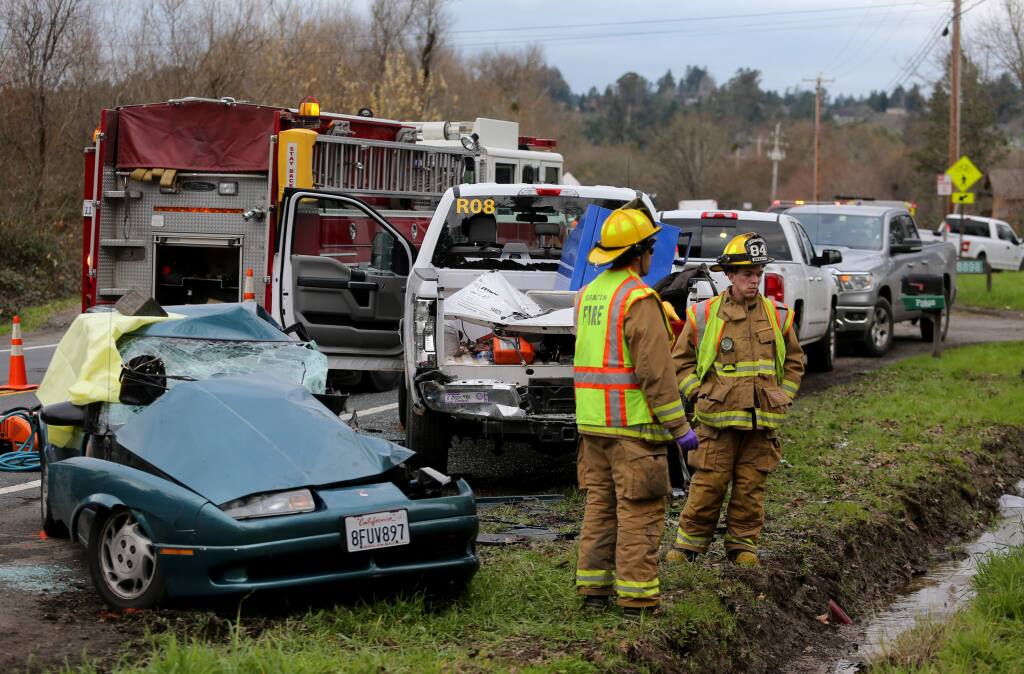 CHP officers and Graton firefighters work at the scene of a fatal car accident on Occidental Road in Sebastopol, California, on Monday, Jan. 14, 2019. (BETH SCHLANKER/ PD)
