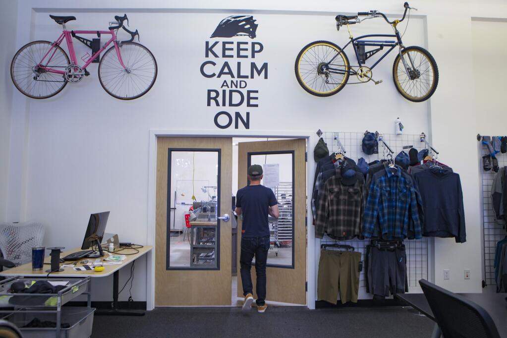Petaluma, CA, USA._Wednesday, July 24, 2019._ Zander Nosler, the founder of Kitsbow, a cycling apparel company based in Petaluma walks into the production room.(CRISSY PASCUAL/ARGUS-COURIER STAFF)