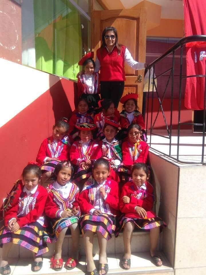 Pictured with their teacher, students at Perus Chicuchas Wasi School for Girls wear traditional outfits of Cusco during a special celebration of their indigenous roots. Rae Lewis of Sonoma opened the school in Cusco in 1997. (JEN WARD)