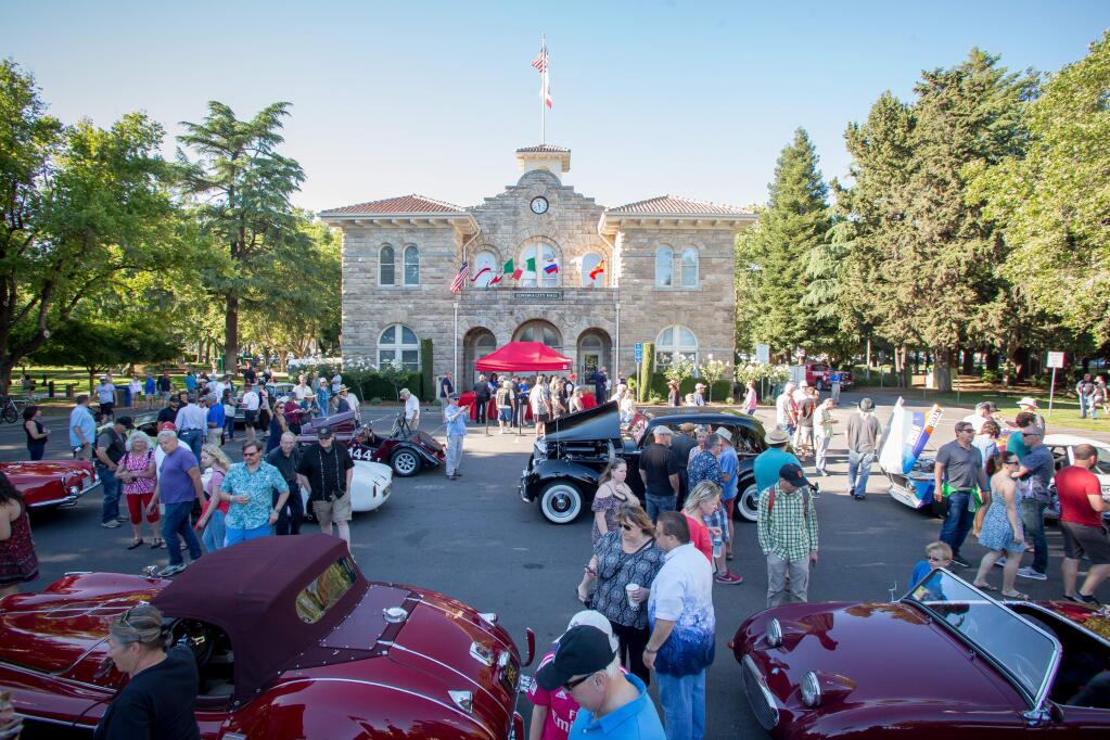 Guests peruse classic cars during the 25th annual Historic Race Car Festival at the Sonoma Plaza in 2017. (Jeremy Portje / For The Press Democrat)