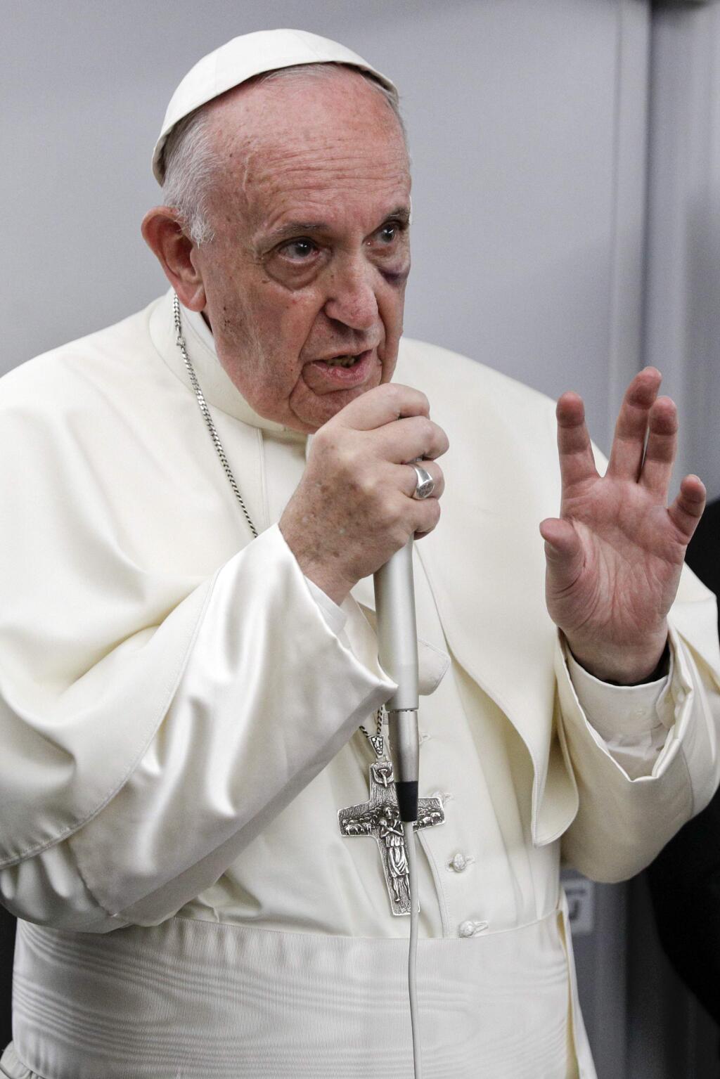 Pope Francis talks to journalists during a press conference he held on board the flight to Rome, at the end of a five-day visit to Colombia, Monday, Sept. 11, 2017. (AP Photo/Andrew Medichini, pool)