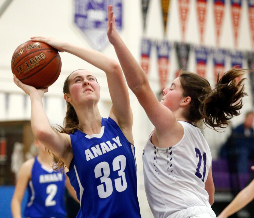 Analy's Aleah Armstrong (33) attempts a shot while Petaluma's Courtney Temple (21) defends during the second half of a girls varsity basketball game between Analy and Petaluma high schools in Petaluma, California on Friday, January 12, 2018. (Alvin Jornada / The Press Democrat)
