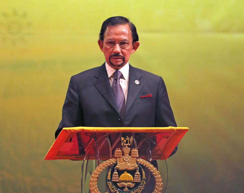 Brunei's Sultan Hassanal Bolkiah is implementing Sharia laws, which punishes crimes including adultery and gay sex with stoning. (VINCENT THIAN / Associated Press, 2013)