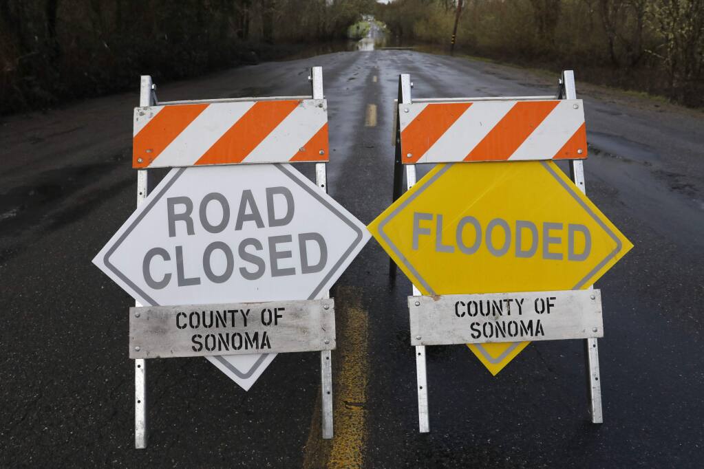 Green Valley Rd is closed due to flooding on Friday, February 10, 2017 in Graton, California . (BETH SCHLANKER/The Press Democrat)
