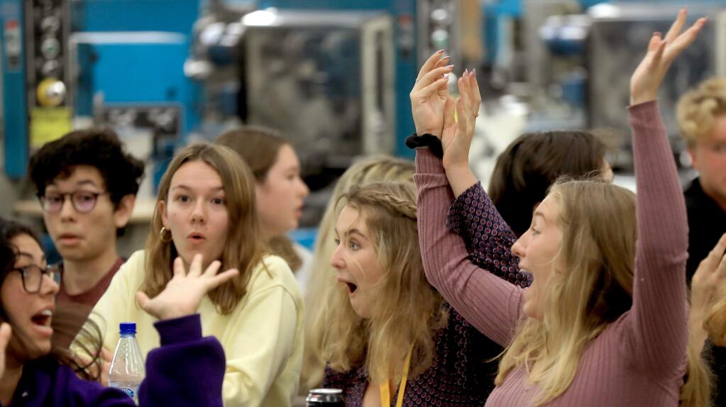 Petaluma High School's Trojan Tribune staffers from left, in yellow, Allison Perkins, Ava Rognlien and Siobhan Hernandez react as they win second place for online excellence during the Press Democrat's 2019 High School Journalism Awards in Rohnert Park, Monday, April 29, 2019. (Kent Porter / The Press Democrat) 2019